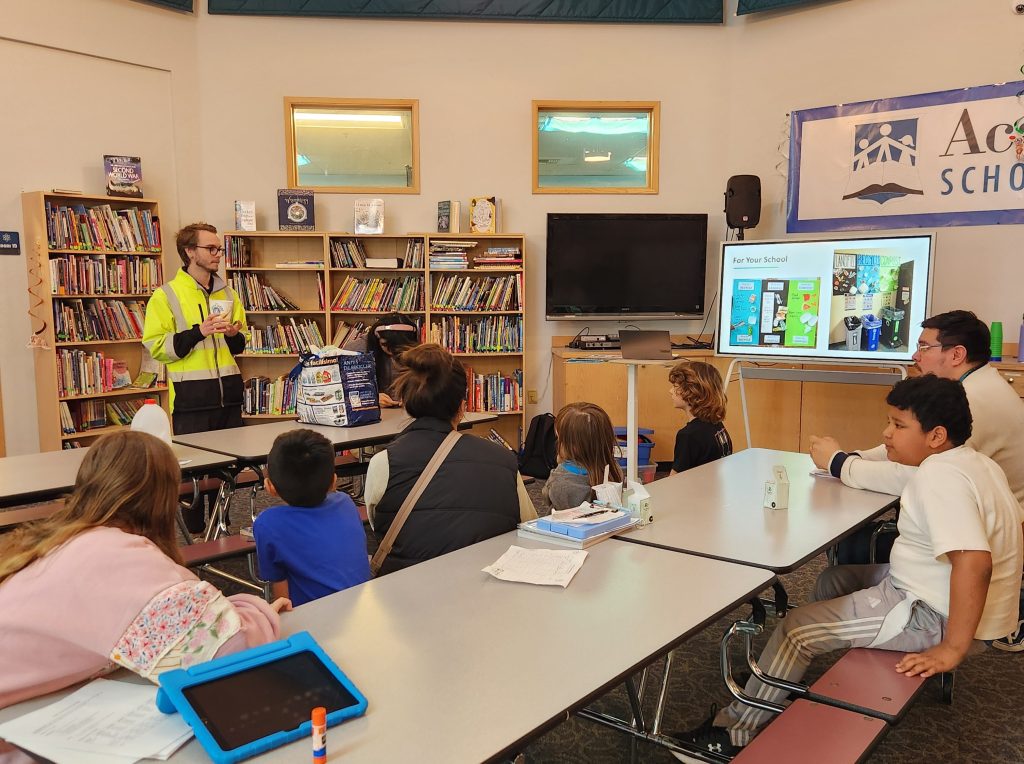 Academy Schools volunteer expert presenting to students